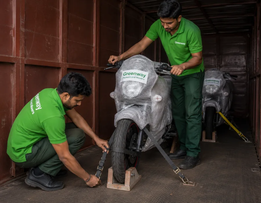 Motorbike secured with wheel straps and chocks inside an enclosed transport carrier
