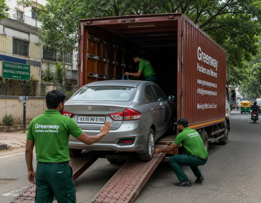 Car being carefully loaded into a fully enclosed Greenway vehicle carrier